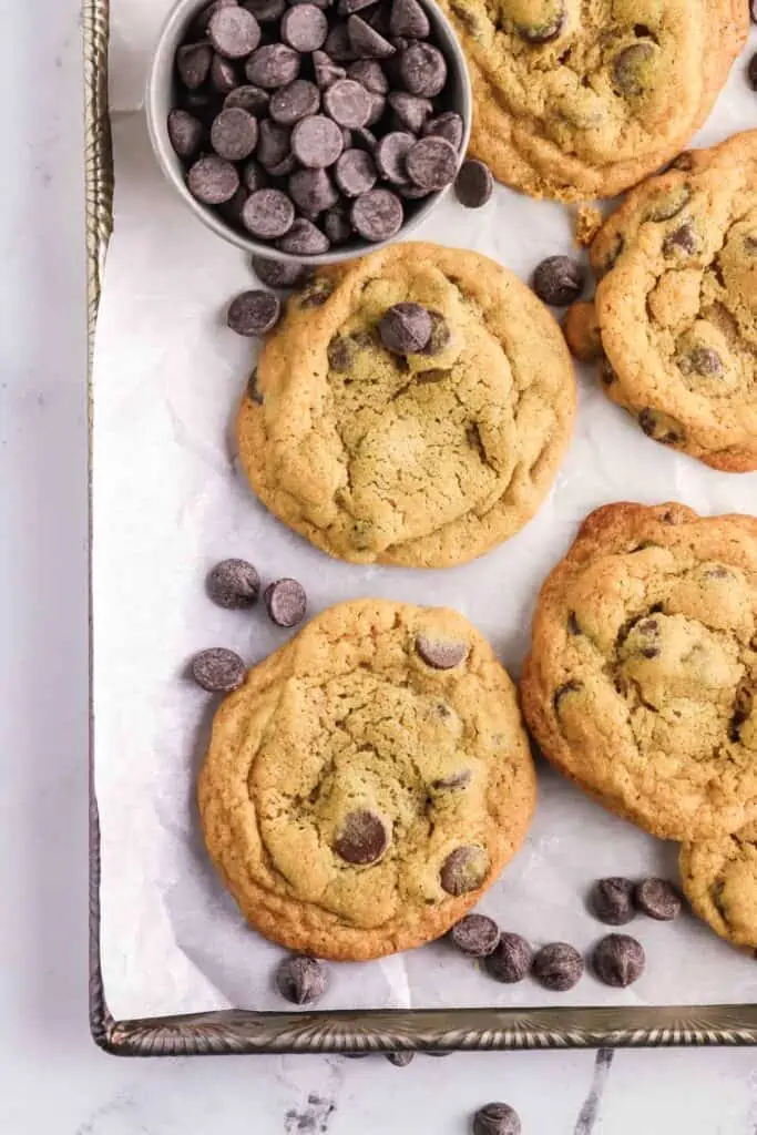 brown sugar chocolate chip cookies on parchment lined cookie sheet