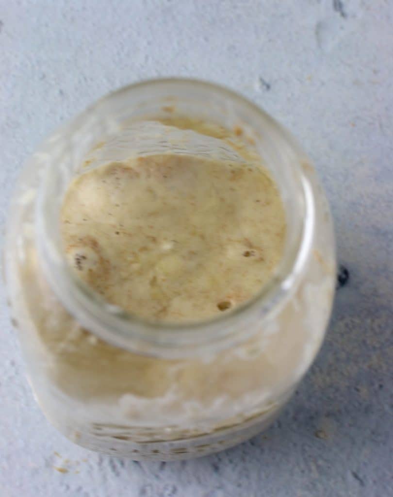 top down view of sourdough starter in a mason jar