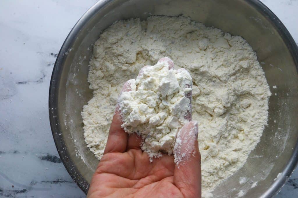 hand holding scone dry ingredients