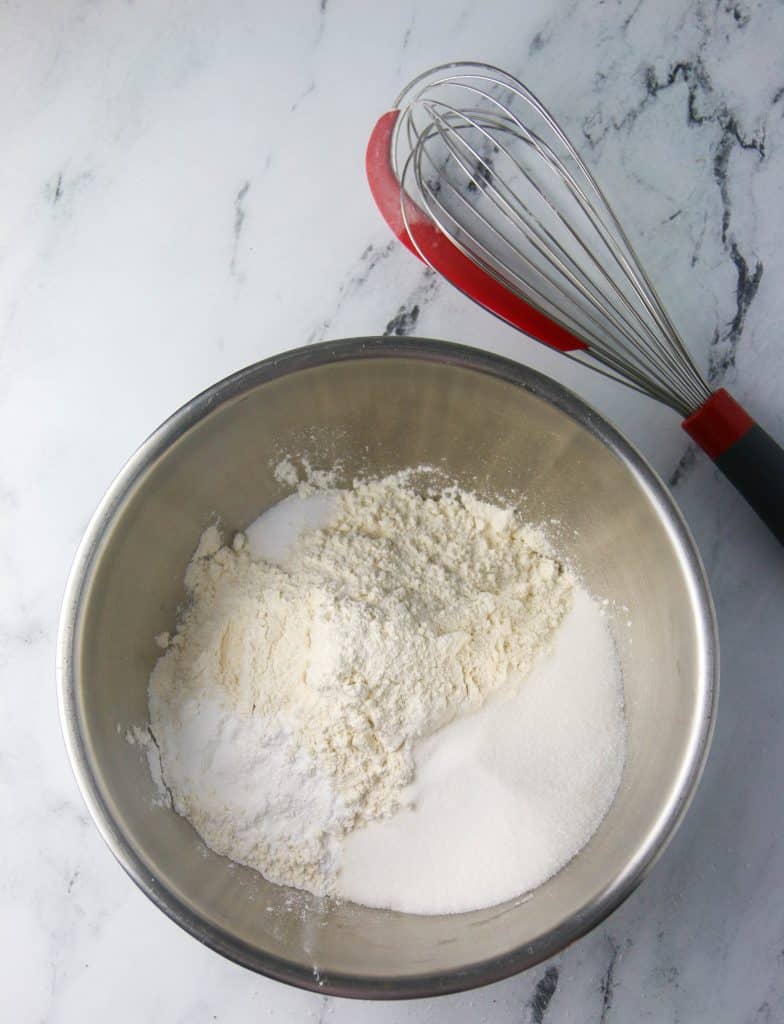 bowl of scone dry ingredients and a whisk