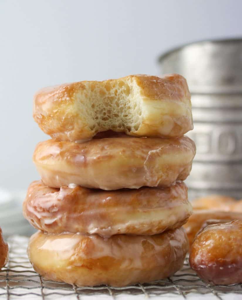 stack of four glazed yeast donuts