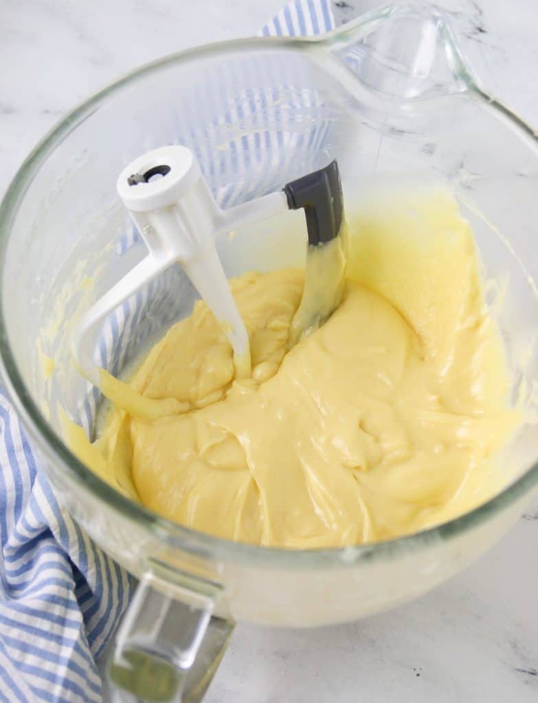 choux pastry dough with a beater in the bowl