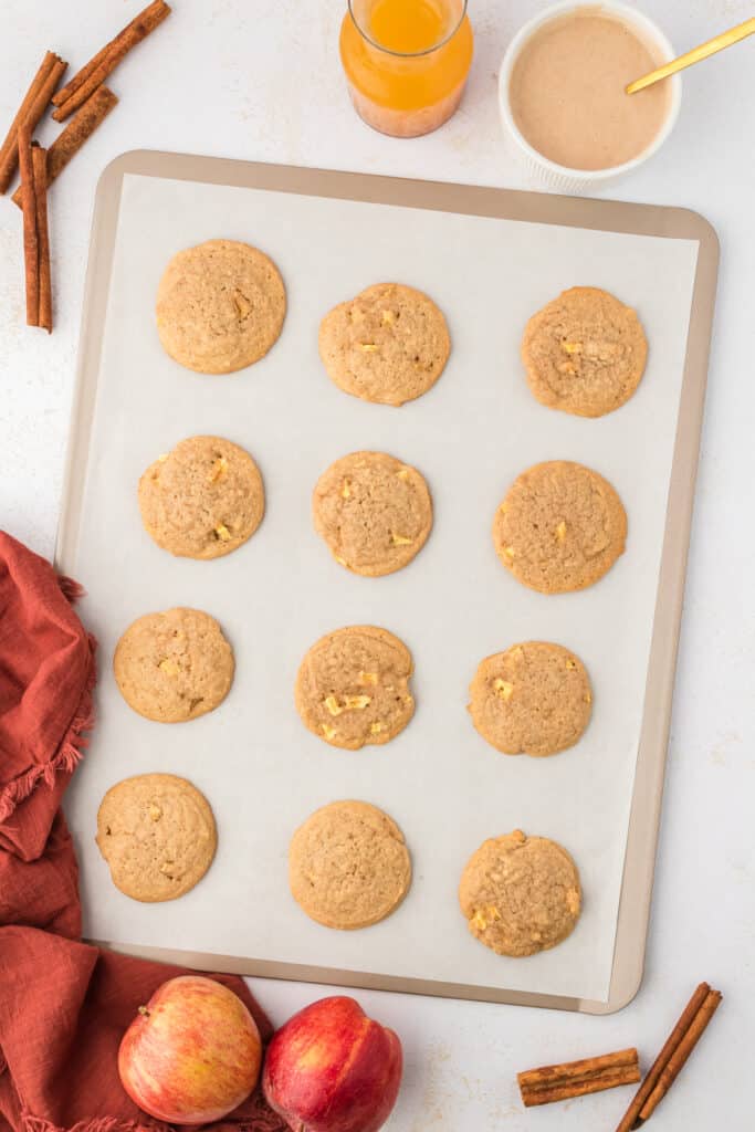 baked apple cider cookies on a cookie sheet