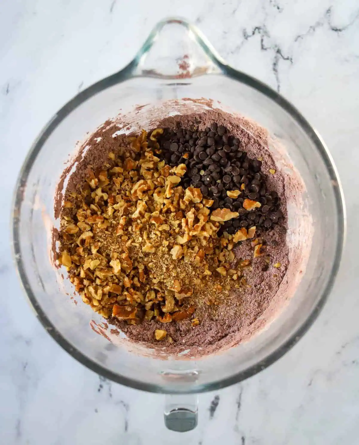 chocolate chips and walnuts added to mixing bowl