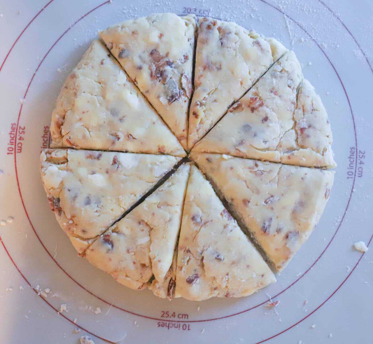 scone dough in a circle and cut into 8 wedges