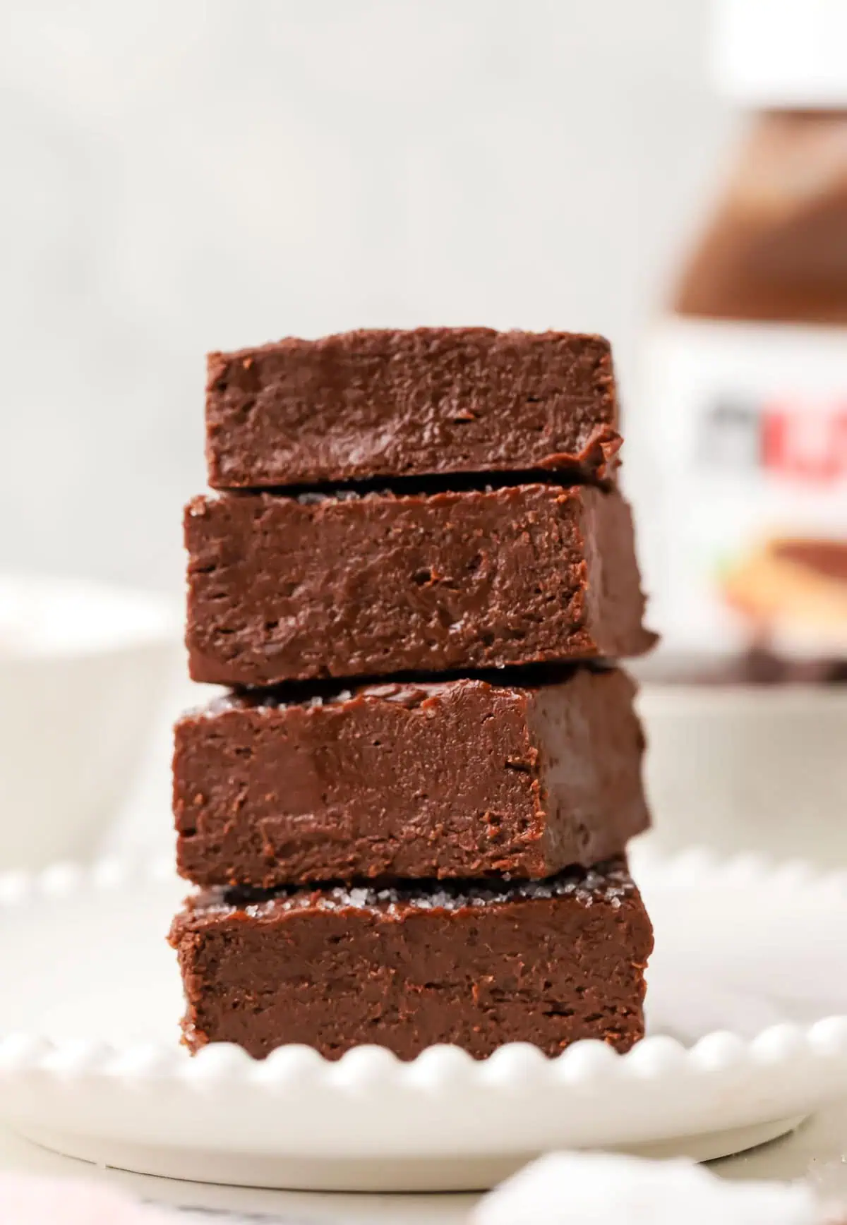 four pieces of nutella fudge stacked on a plate