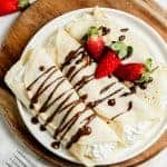 two rolled french crepes on a plate