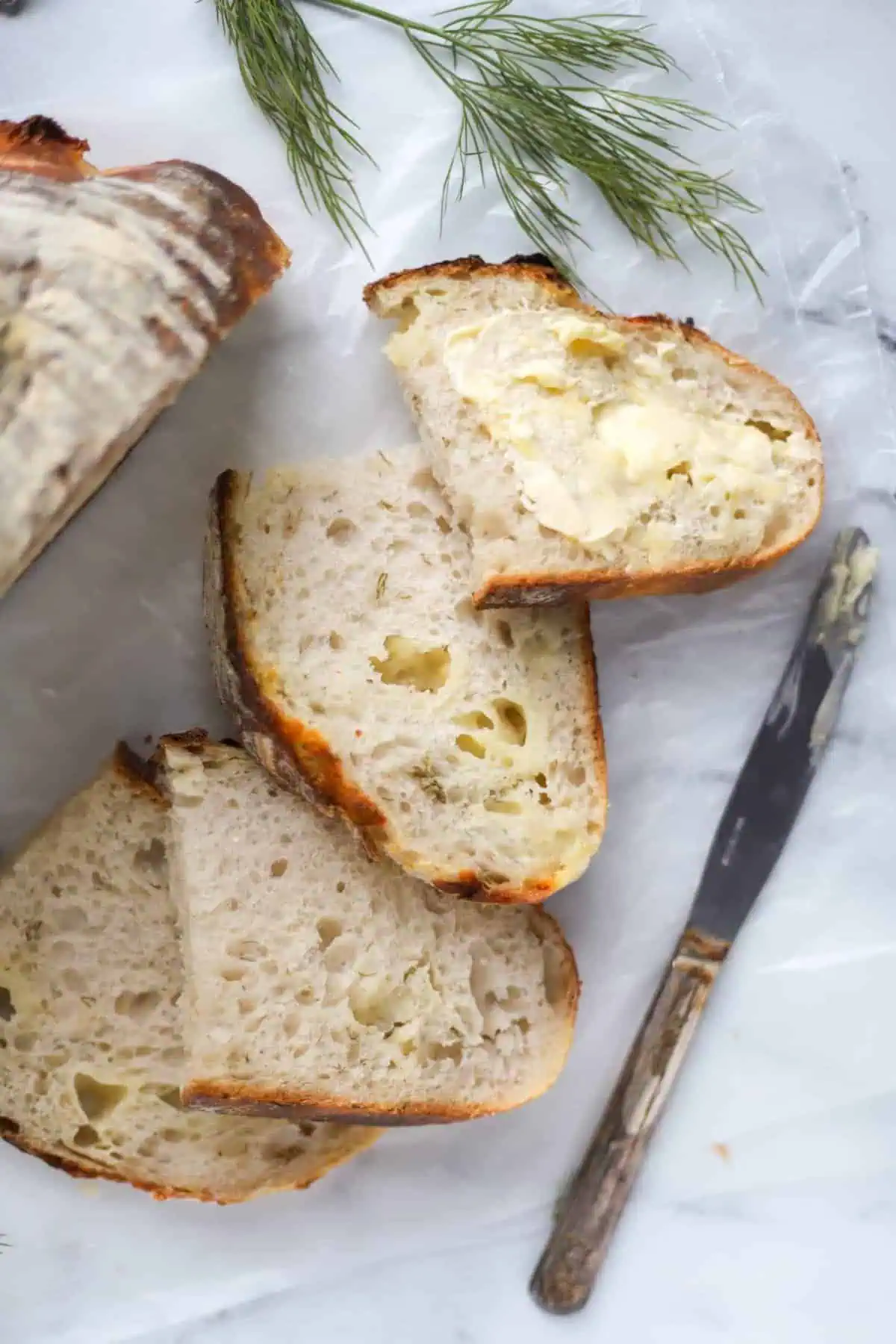 four slices sourdough cheddar dill bread