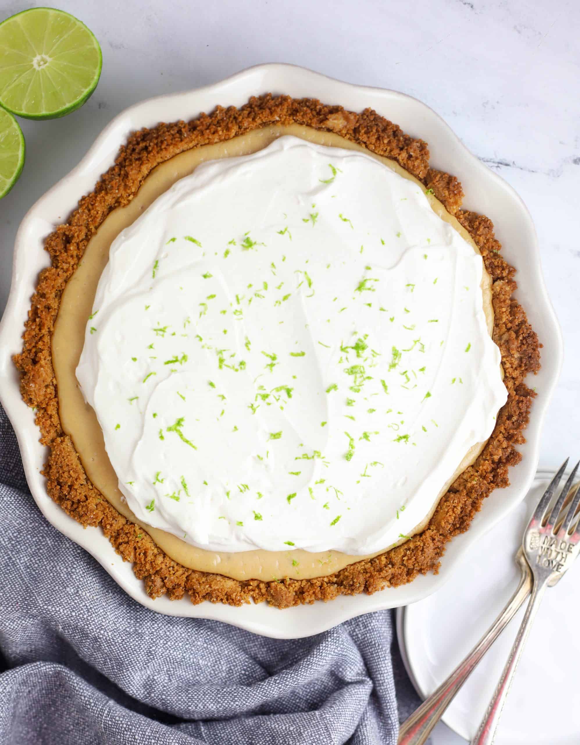 whole key lime pie topped with whipped cream