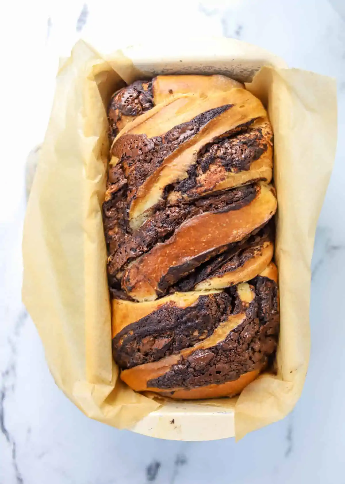 baked sourdough chocolate babka bread in loaf pan