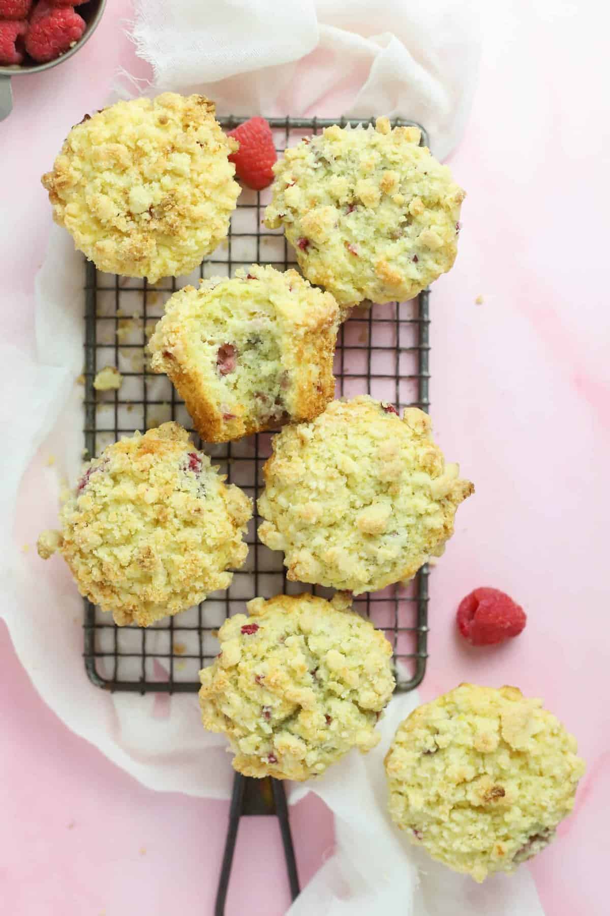 raspberry cream cheese muffins on a cooling rack