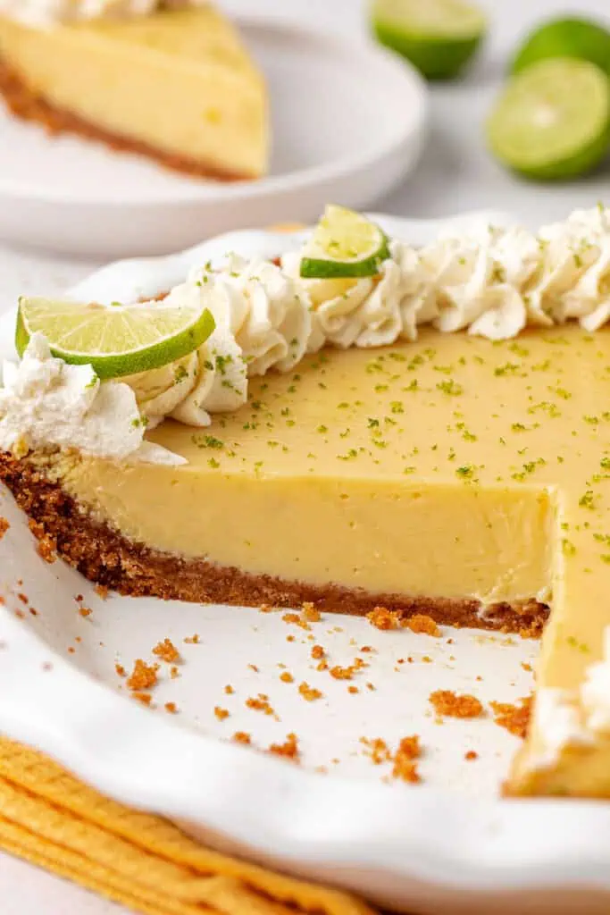 key lime pie with a few slices missing