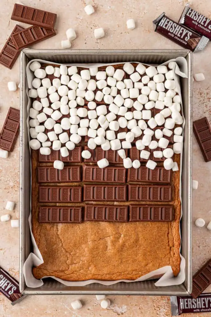 graham cracker bar topped with chocolate bars and marshmallows