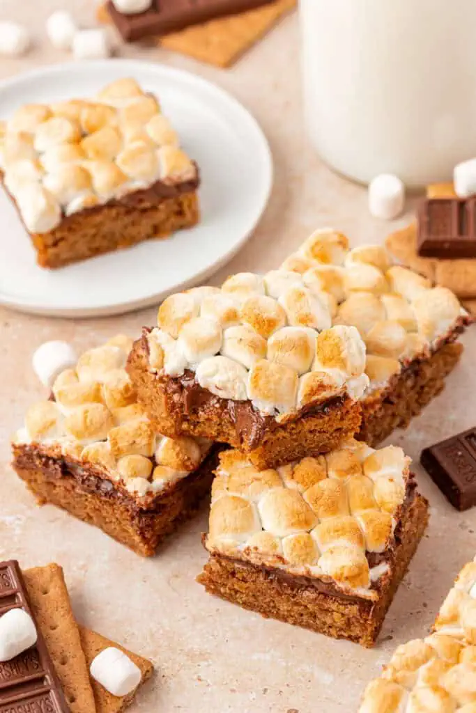 smores bars with some on a plat