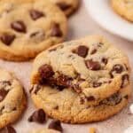two cookies stacked and the top cookie has a bite taken out of it