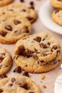 two cookies stacked and the top cookie has a bite taken out of it