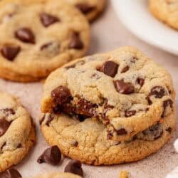 two cookies stacked and the top cookie has a bite taken out of it