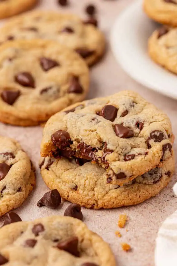 two cookies stacked and the top cookie has a bite taken out of it