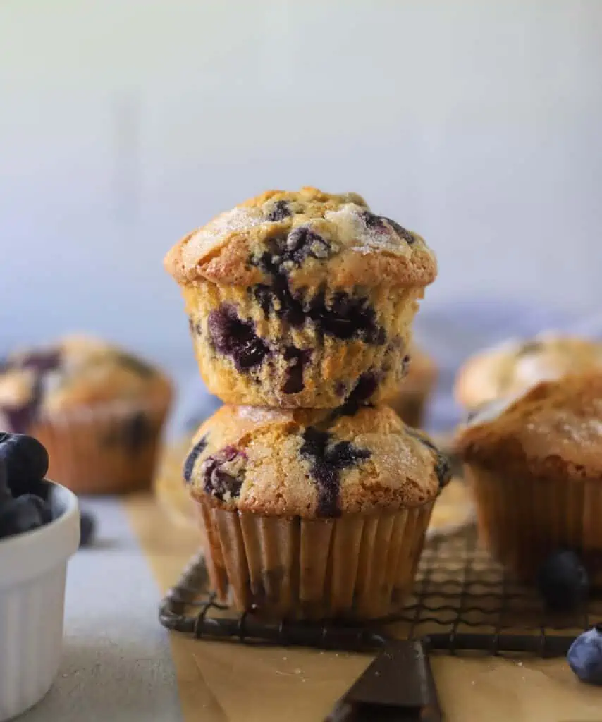 two blueberry muffins stacked on top of each other