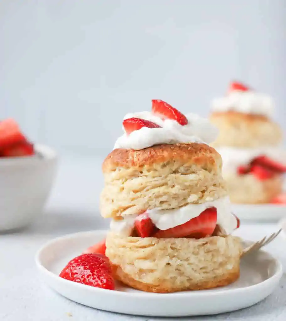 sourdough shortcake biscuit filled with whipped cream and topped with strawberries