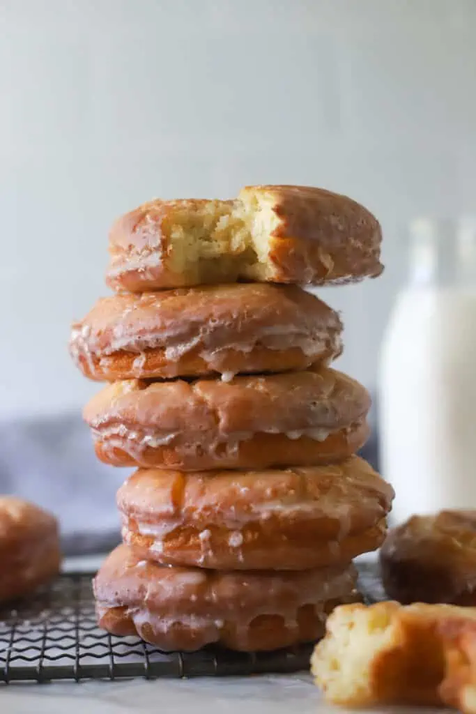 five old fashioned sour cream donuts stacked on top of each other