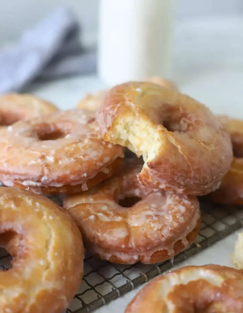 old fashioned sour cream donut with a bite taken out of it