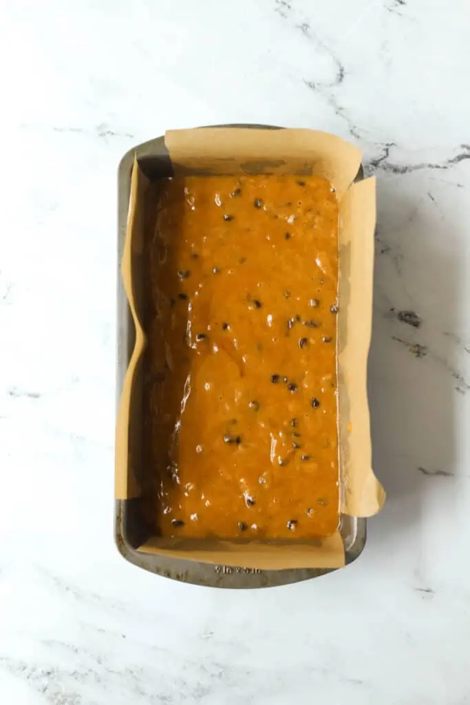 chocolate chip pumpkin bread batter in a loaf pan