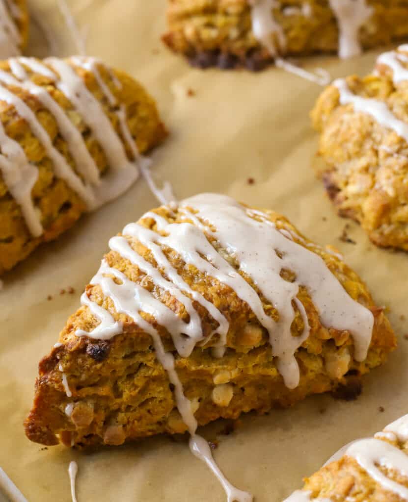 pumpkin scone on a baking sheet lined with parchment paper
