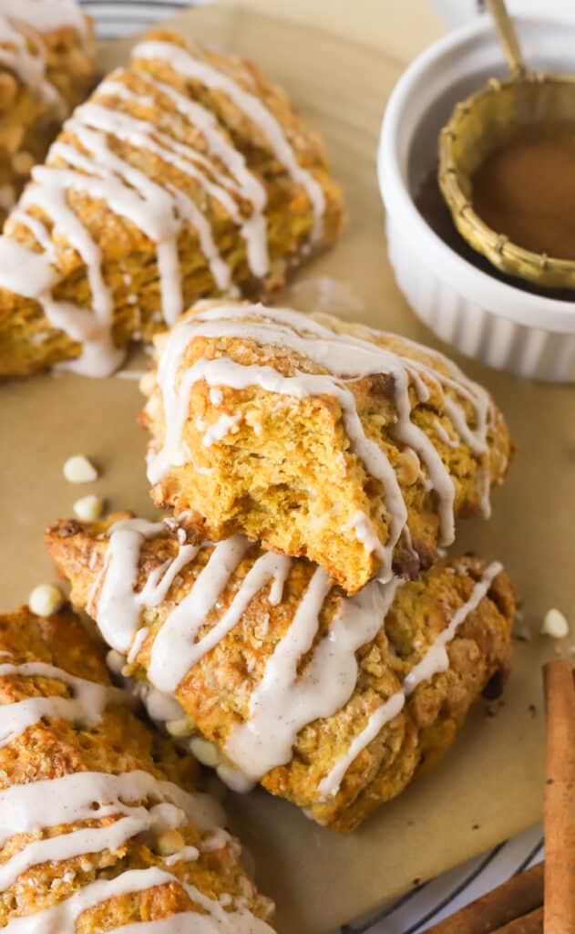 pumpkin scones with one that has a bite taken out of it