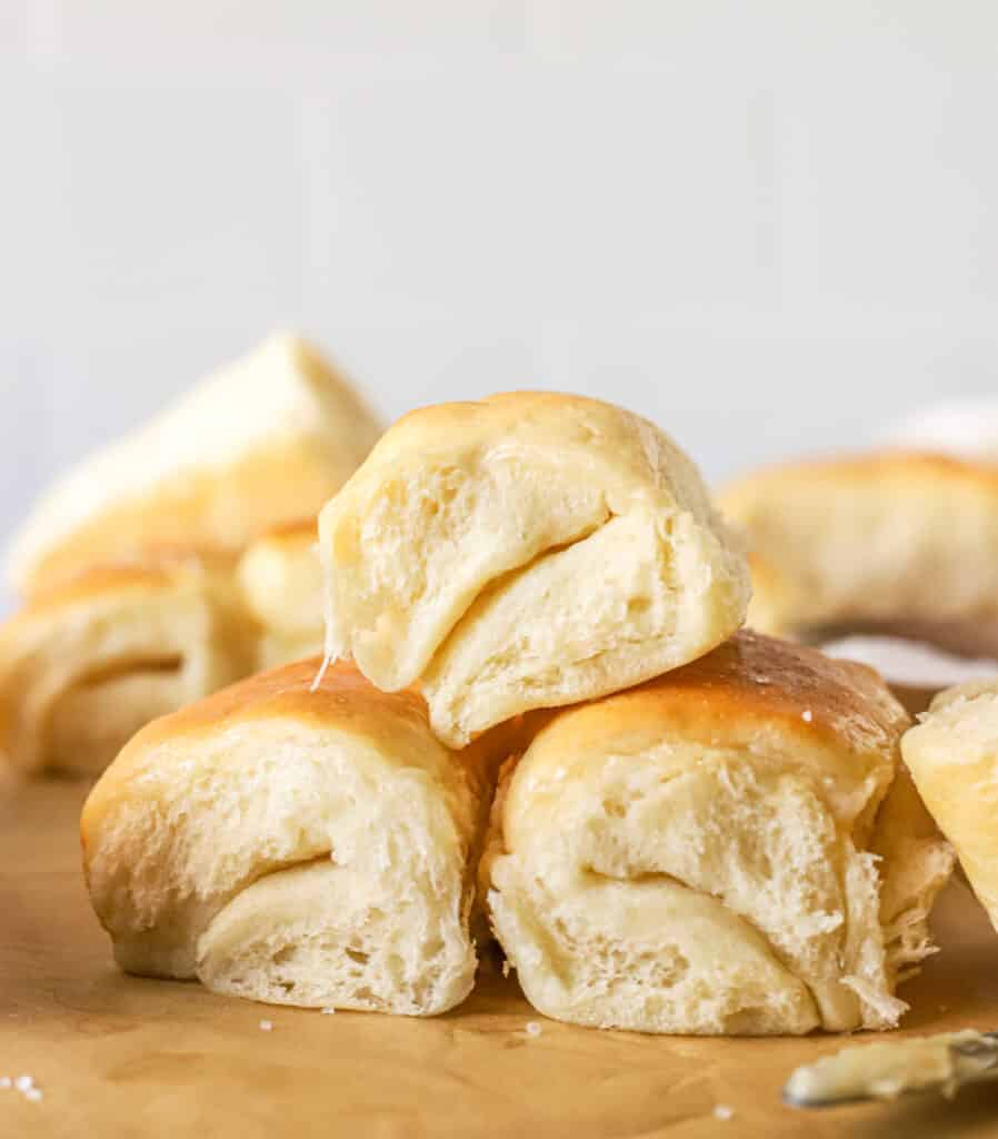 three parker house rolls stacked on top of each other