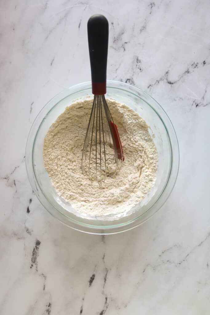 bowl of dry ingredients with a whisk