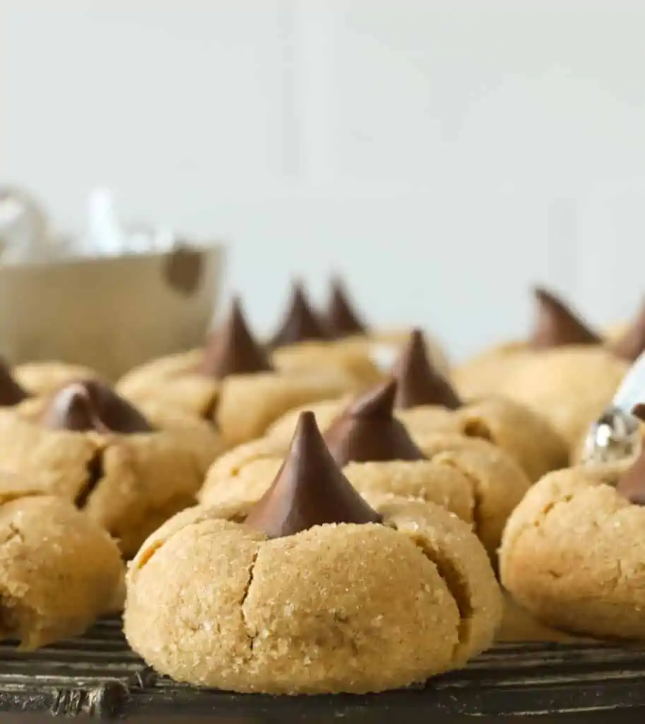 peanut butter chocolate kiss cookies on a wire rack