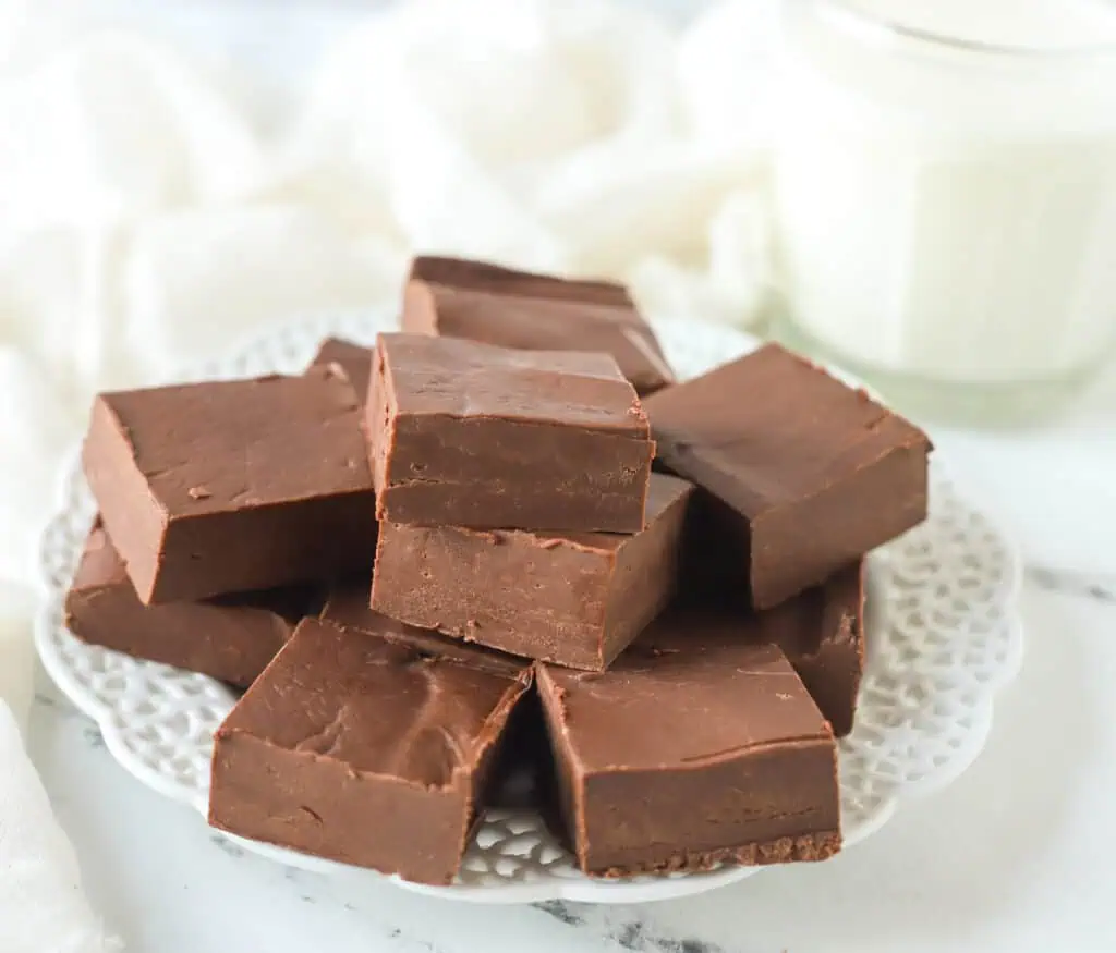 chocolate fudge squares on a white plate