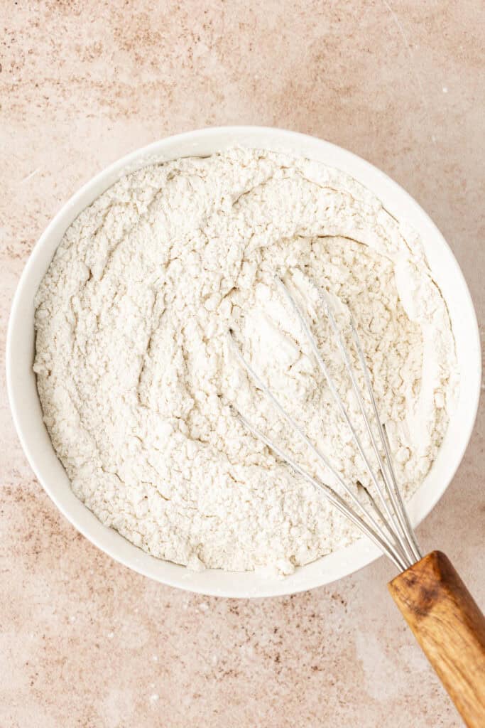 bowl of dry ingredients in a bowl with a whisk