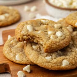 white chocolate chip cookie with bite taken out of it