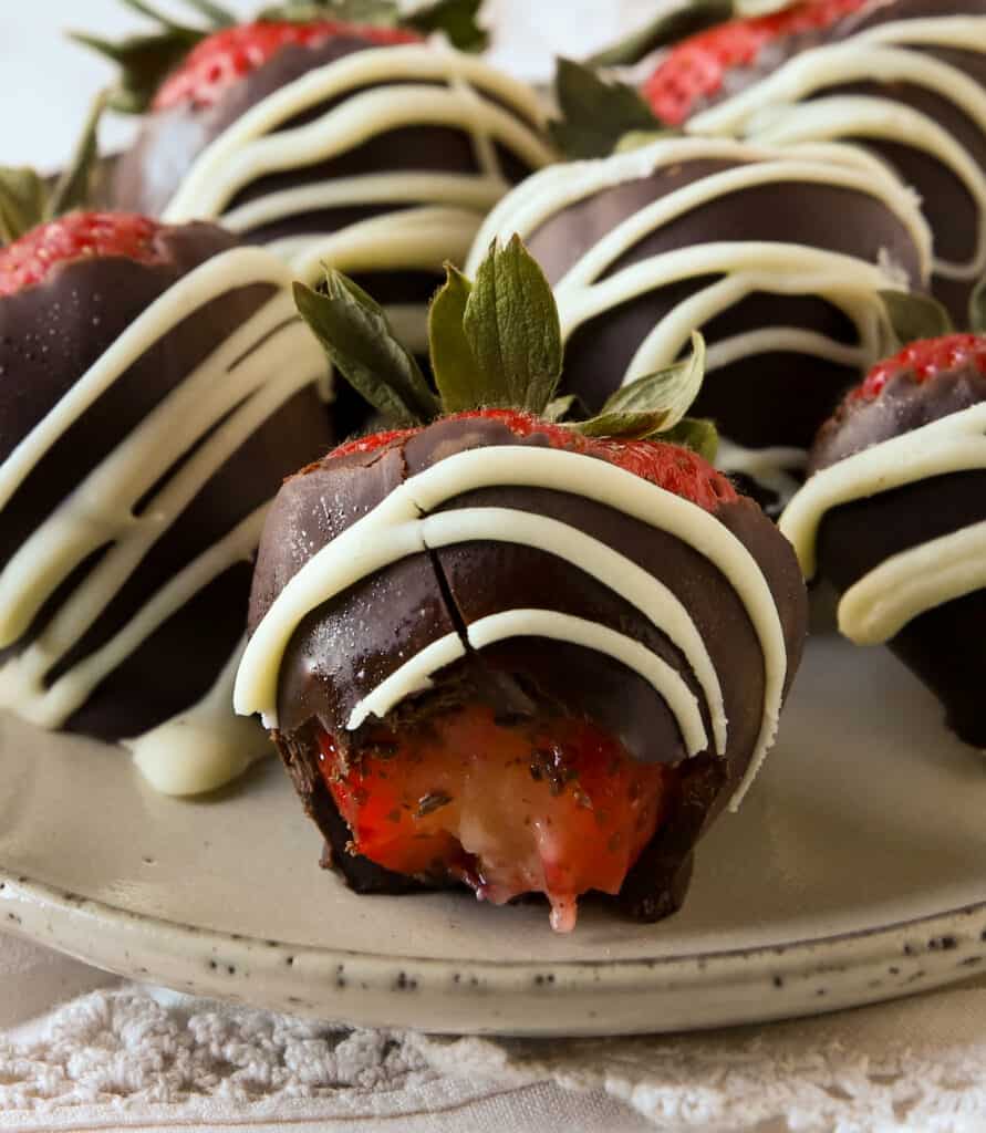 chocolate covered strawberry with a bite taken out of it