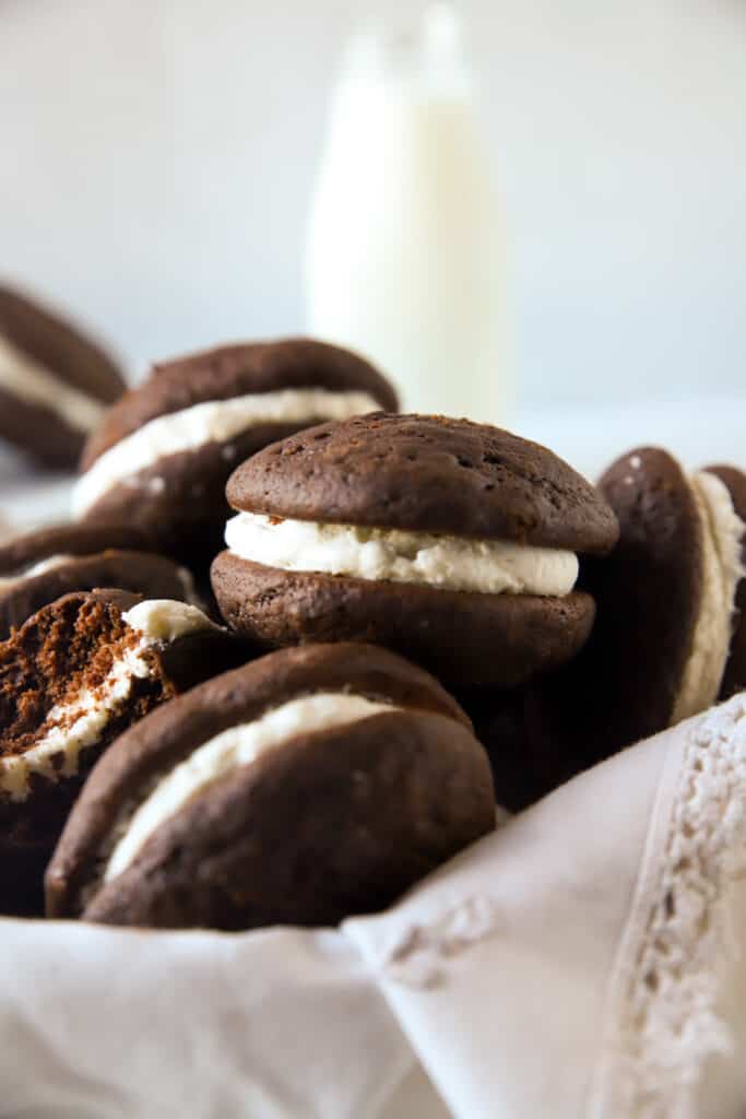 several whoopie pies on a linen lined basket