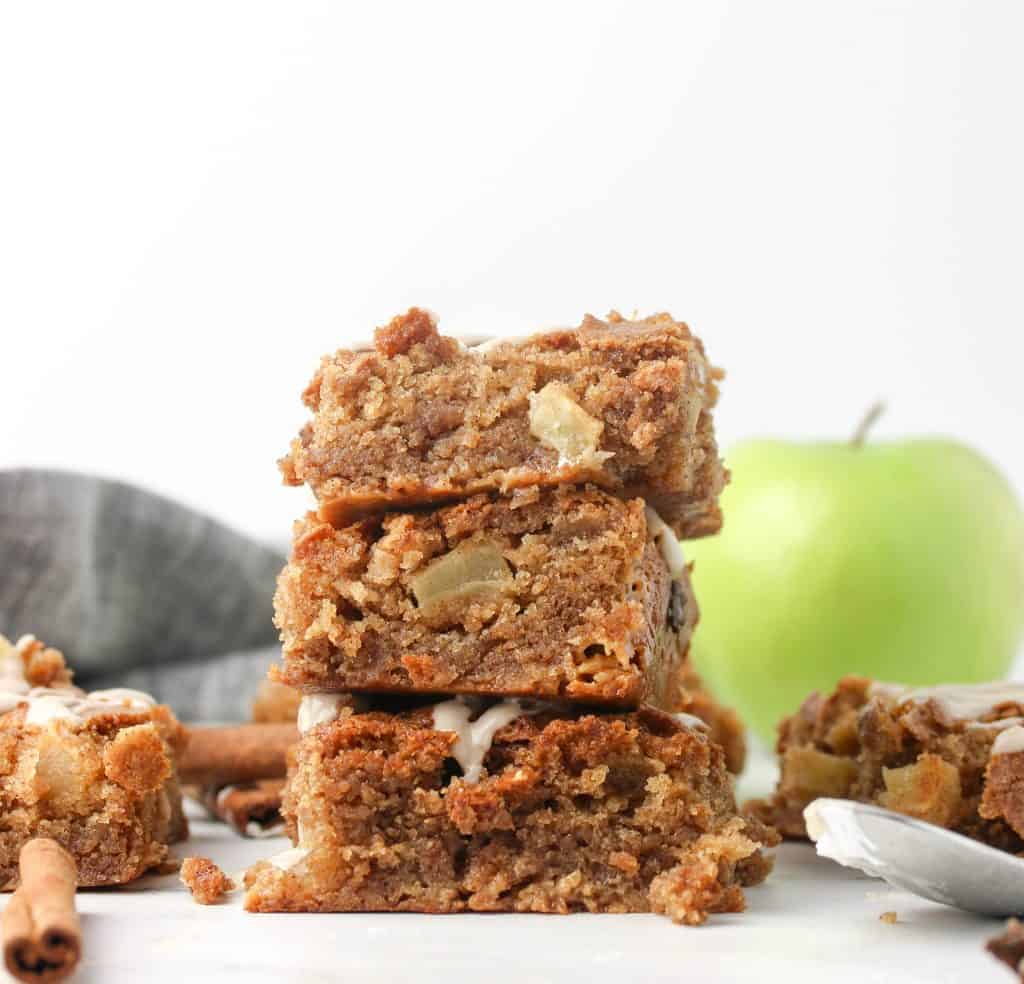 three gooey apple bars stacked on top of each other