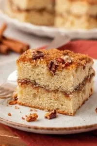 a slice of cinnamon coffee cake on a plate