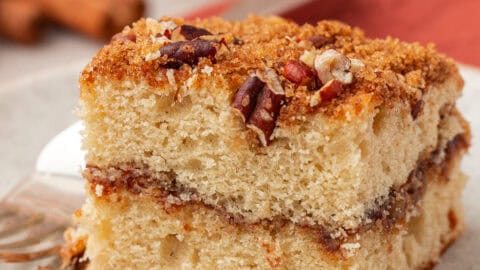 a slice of cinnamon coffee cake on a plate