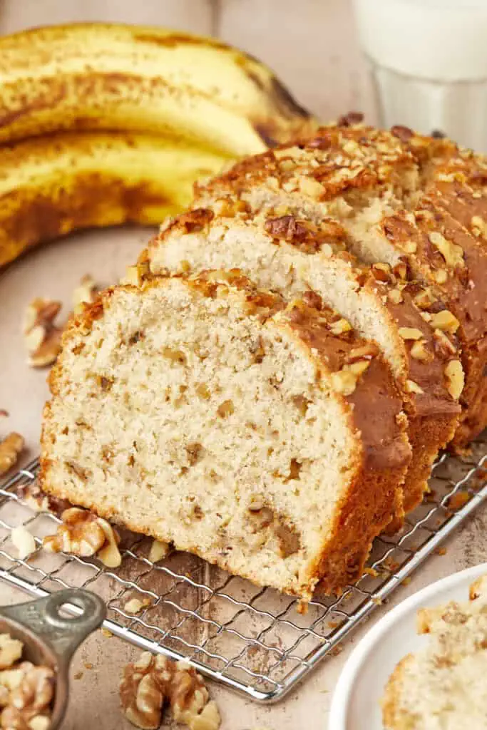 slices of banana nut bread on a cooling rack