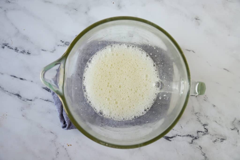 frothy egg whites in a bowl