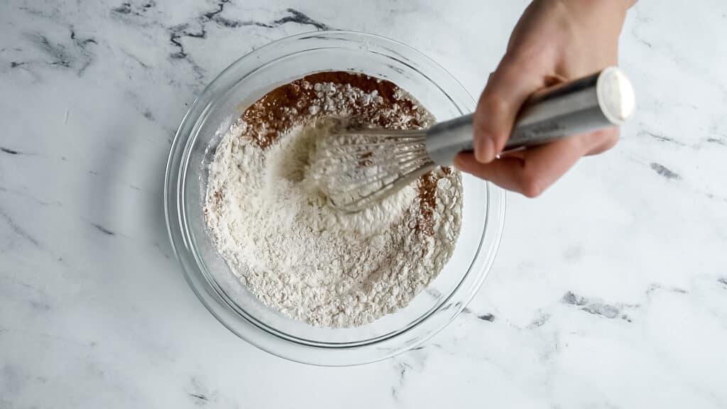 hand whisking a bowl of dry ingredients