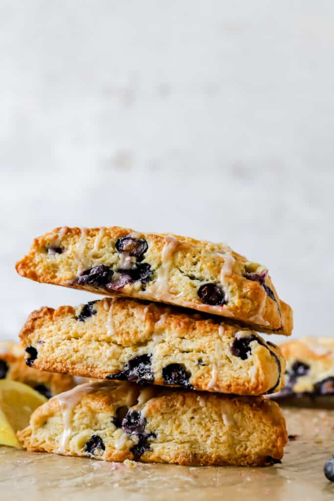 three blueberry lemon scones stacked on top of each other