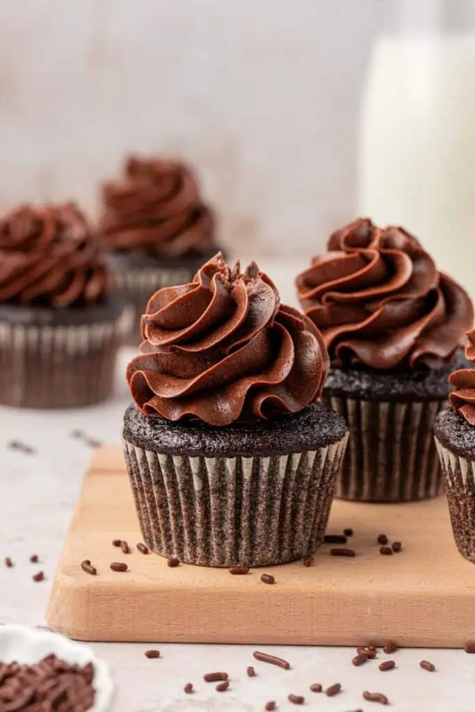 chocolate cupcakes topped with chocolate buttercream frosting