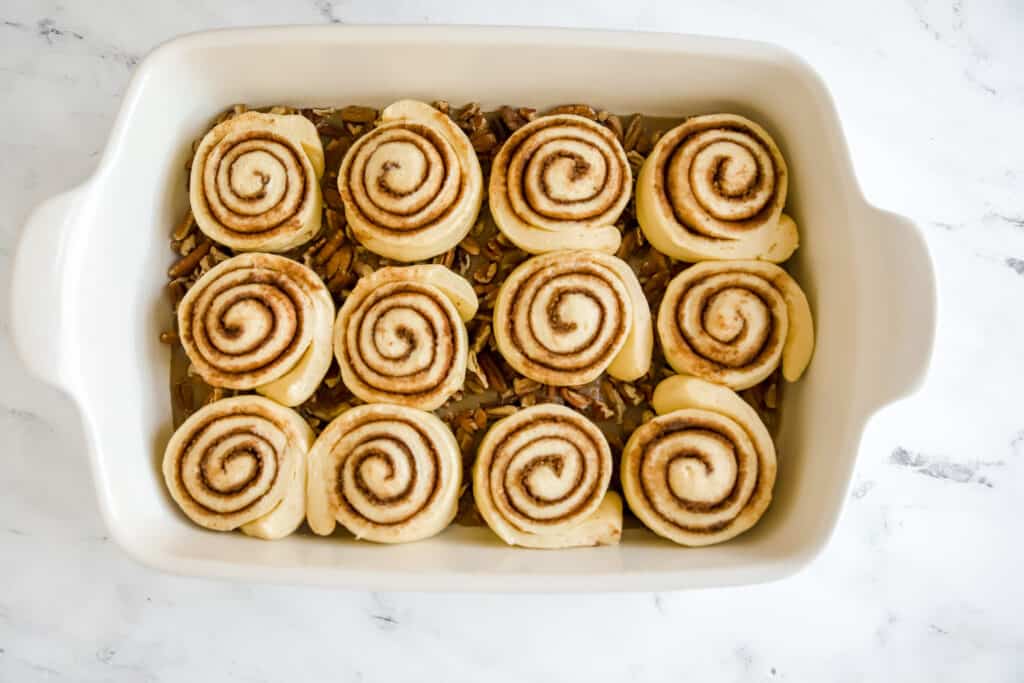 unbaked risen pecan sticky buns in pan
