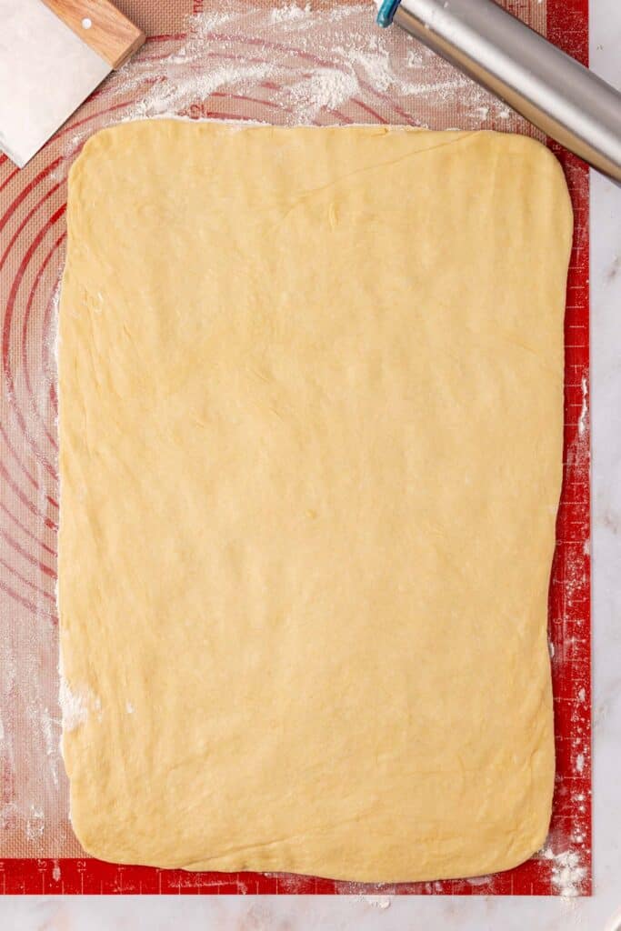 cinnamon roll dough rolled into large rectangle