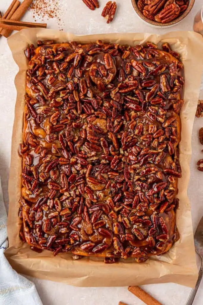 pecan buns flipped out onto parchment paper