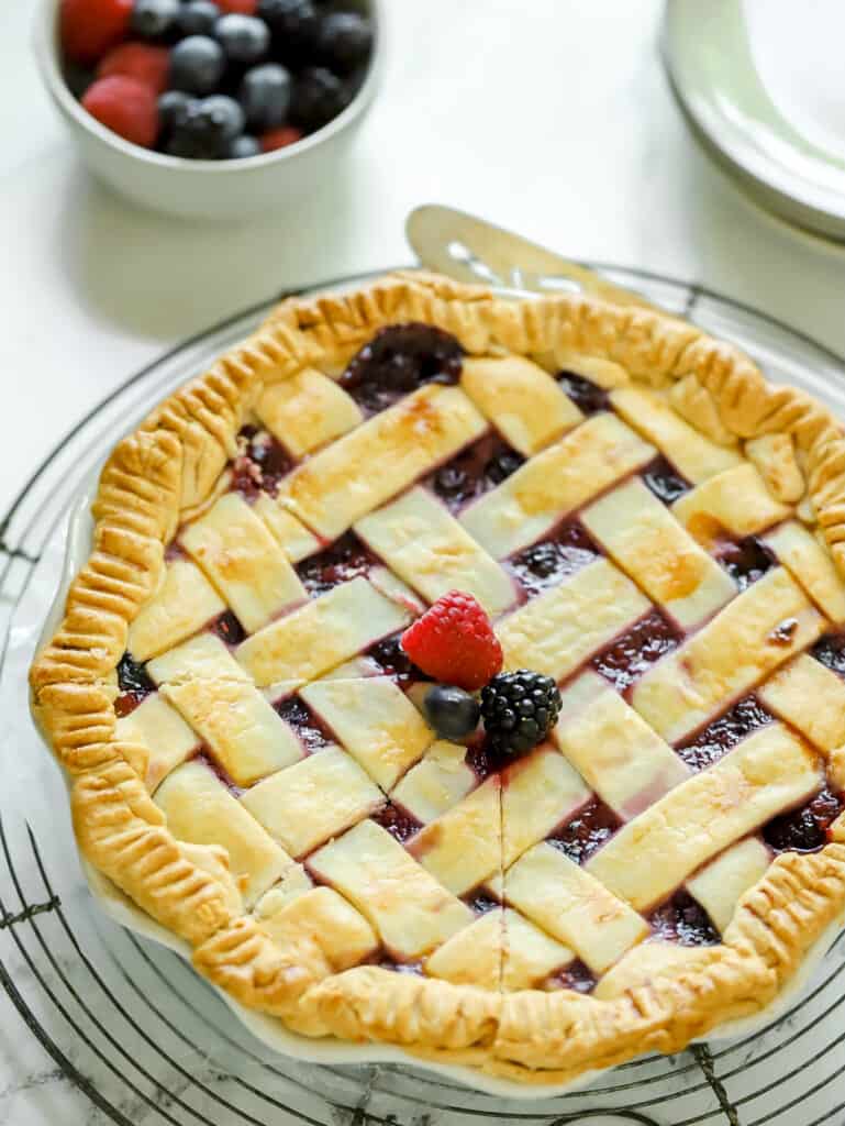 whole berry pie on a cooling rack