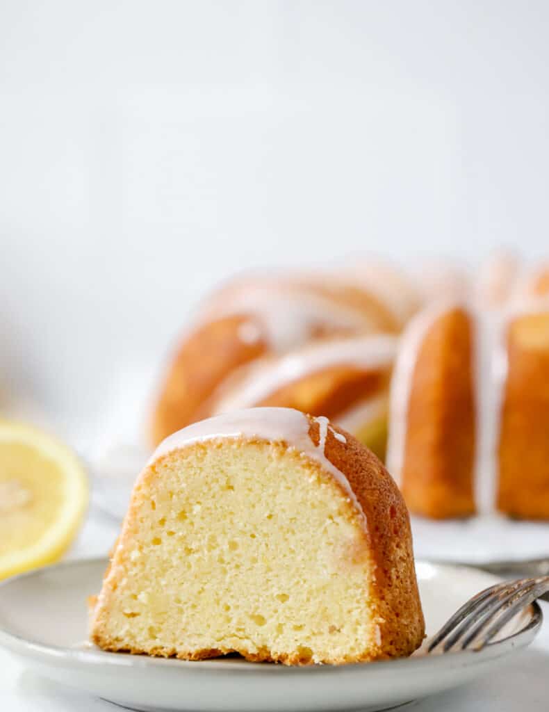 slice of lemon sour cream pound cake upright on a plate